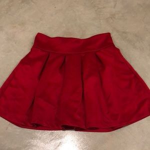 Red pleated skirt